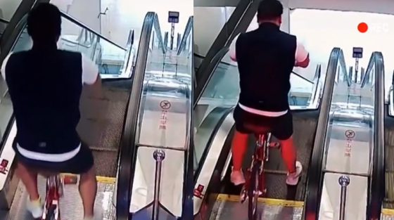 Άνδρας σε ποδήλατο κατεβαίνει κυλιόμενη σκάλα