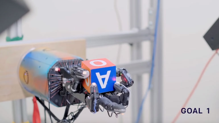 Ένα νέο επιδέξιο ρομποτικό χέρι παίζει στα δάχτυλα έναν κύβο Ένα νέο επιδέξιο ρομποτικό χέρι παίζει στα δάχτυλα έναν κύβο