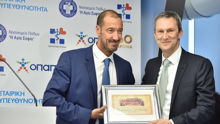 Εμμανουήλ Παπασάββας Κοινός Διοικητής των Διασυνδεόμενων Παιδιατρικών Νοσοκομείων, Ντάμιαν Κόουπ Διευθύνων Σύμβουλος ΟΠΑΠ