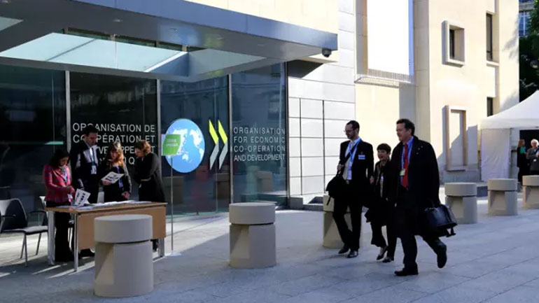 O ΟΟΣΑ προειδοποιεί για περαιτέρω επιβράδυνση της παγκόσμιας οικονομίας