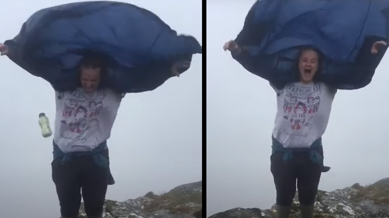 Άνδρας προσπαθεί να κρατήσει το μπουφάν στη θέση του 