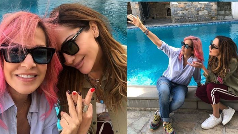 Η Δέσποινα Βανδή ποζάρει με ρούχο της Σοφίας Καρβέλα που έχει φορέσει και η Άννα Βίσση