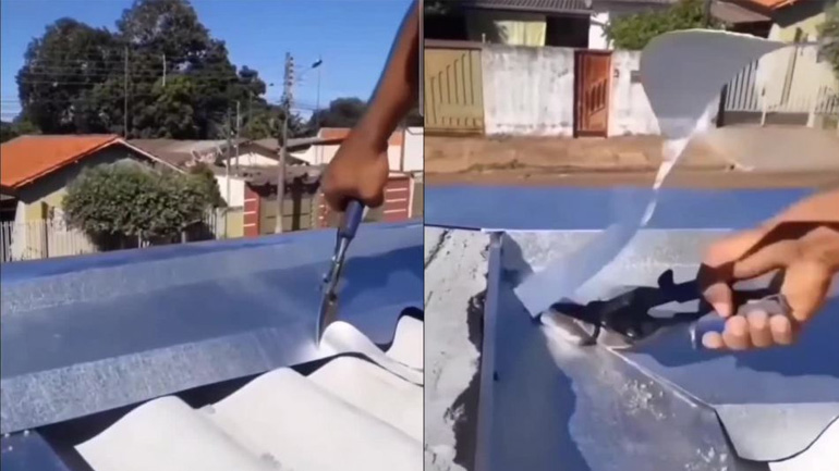 Tεχνίτης κόβει με ψαλίδι μεταλλικό φύλλο οροφής Tεχνίτης κόβει με ψαλίδι μεταλλικό φύλλο οροφής