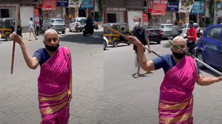 Γυναίκα κάνει κινήσεις πολεμικής τέχνης με δύο στικ