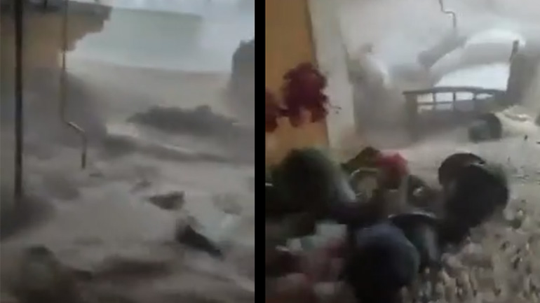 Πλημμύρα γκρεμίζει την γκαραζόπορτα ενός σπιτιού