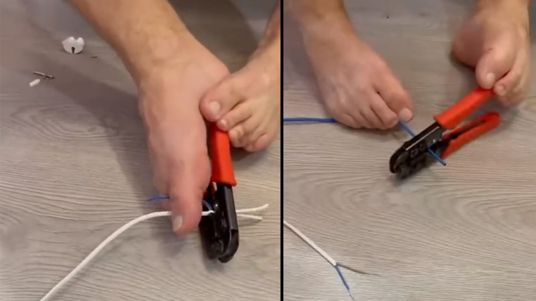 Hλεκτρολόγος επισκευάζει μια πρίζα με τα πόδια του