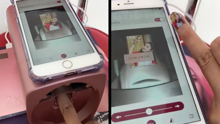 Γυναίκα εκτυπώνει μια φωτογραφία στο νύχι της