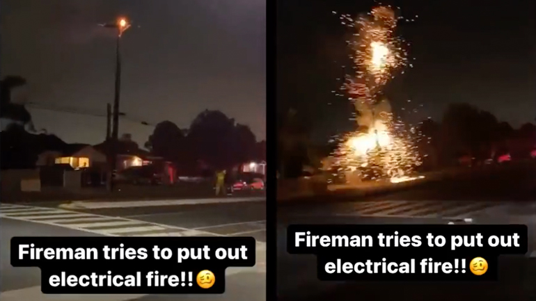 Πυροσβέστης σβήνει μια φωτιά σε στύλο ηλεκτρικού ρεύματος