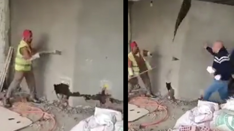 Άντρας περνά τη λάθος στιγμή δίπλα σε έναν εργάτη που γκρεμίζει έναν τοίχο