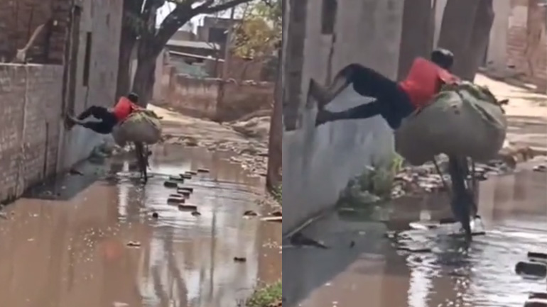 Ποδηλάτης περνά έναν βρεγμένο δρόμο χωρίς να λερωθεί