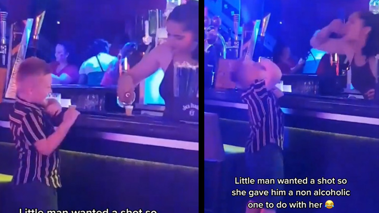 Μικρό αγόρι πίνει σφηνάκι με μια σερβιτόρα 