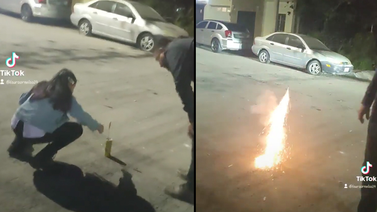 Μια γυναίκα ανάβει το πρώτο της πυροτέχνημα