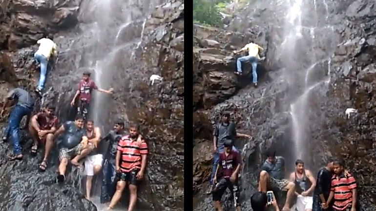 Άνδρας σκαρφαλώνει στα βράχια ενός καταρράκτη