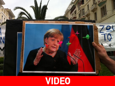 Πέταξαν βελάκια στη φωτογραφία της Μέρκελ